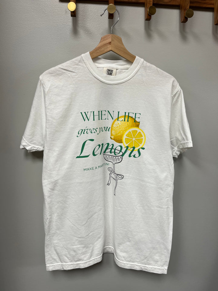 White tee with green and yellow graphic, when life gives you lemons make a martini