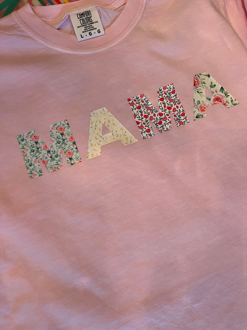Pink tee with MAMA floral graphic