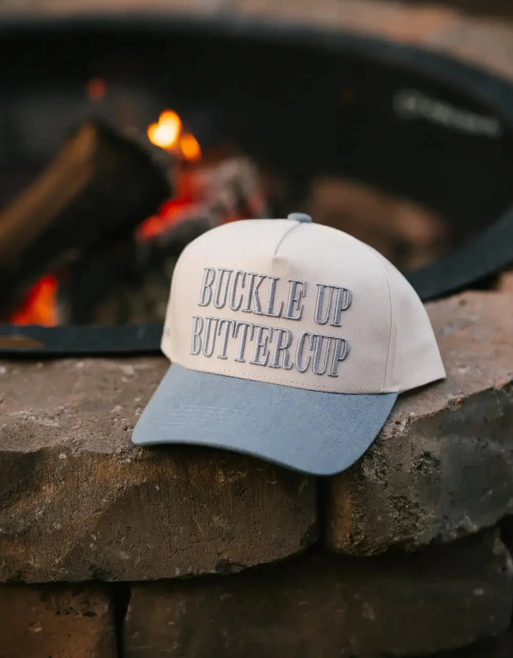 Trucker hat with 'Buckle Up Buttercup' text 