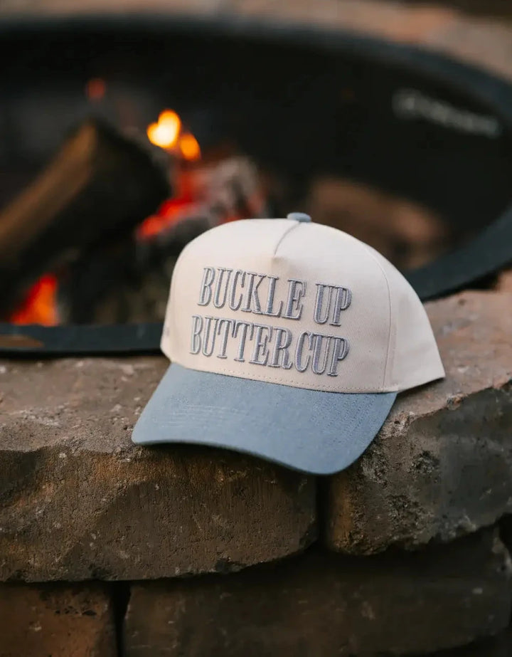 Trucker hat with 'Buckle Up Buttercup' text 