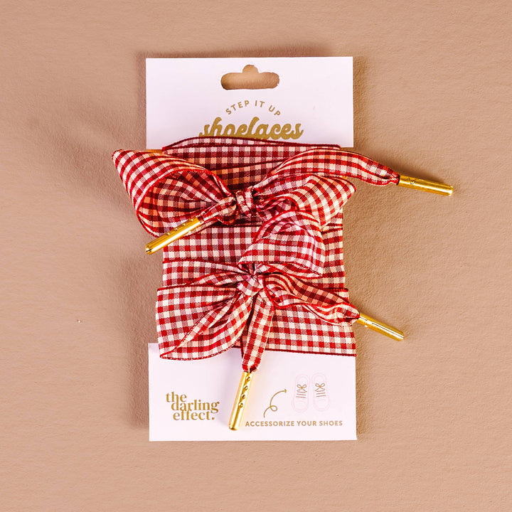 Red and white checkered shoelaces with gold accents, gingham red shoelaces