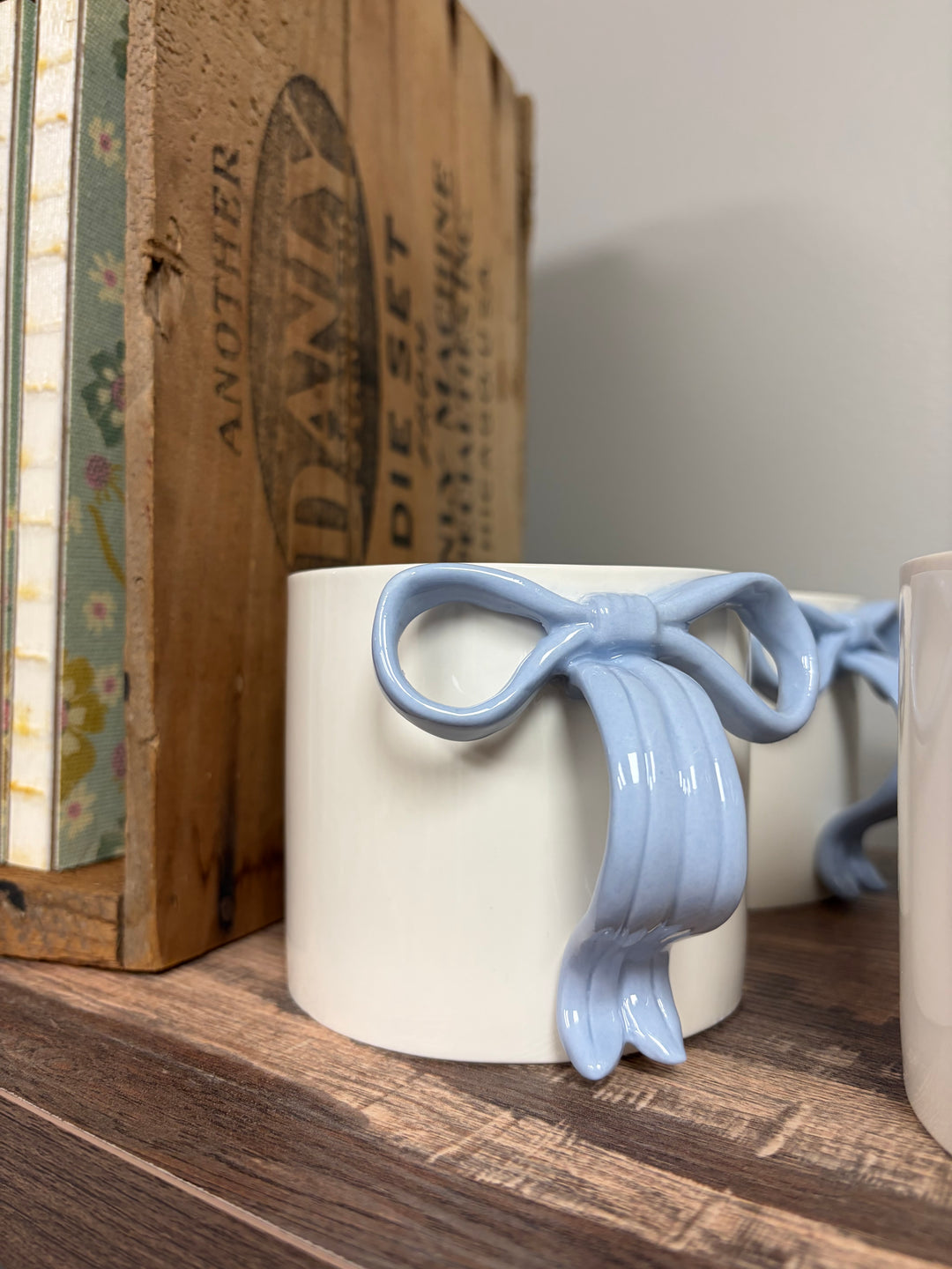 Cream mug with blue ribbon handle