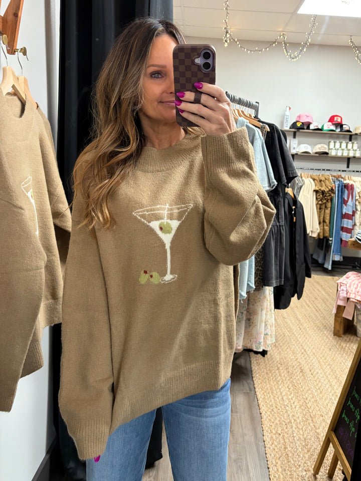 Tan colored mock neck sweater with a martini glass and olives graphic