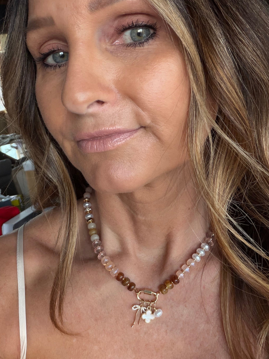 Neural colored beaded necklace with charms