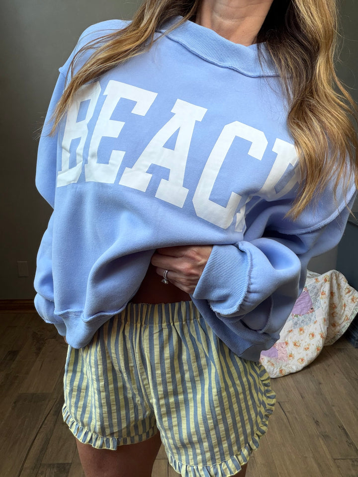 Light blue reversible mockneck cropped sweatshirt with BEACH on one side and LAKE on the other