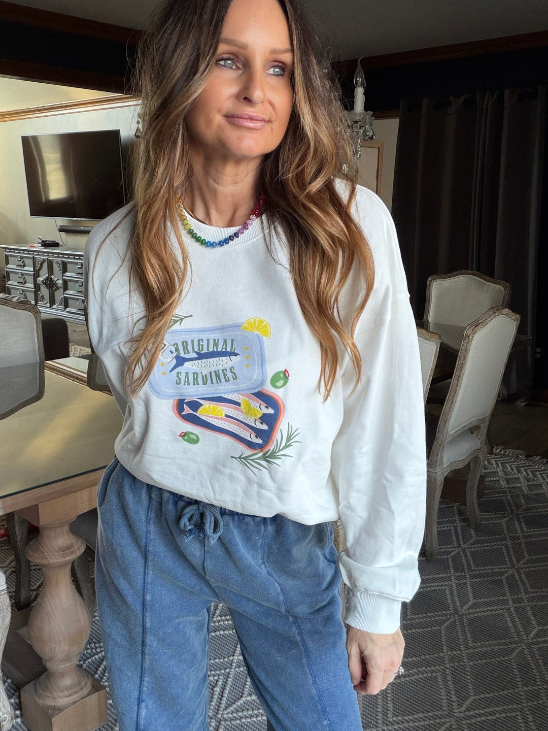 White crewneck with sardine graphic