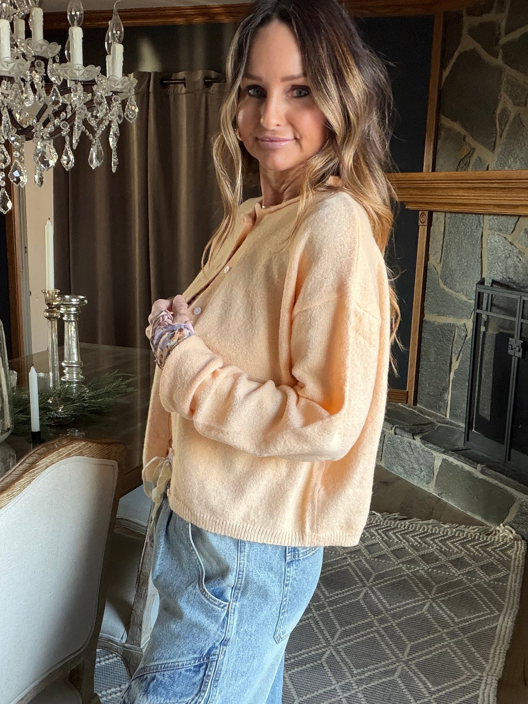 Lightweight apricot colored button down cardigan hip length crewneck