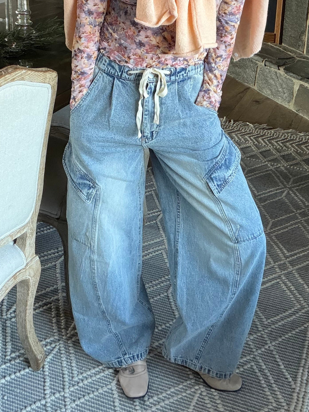 Wide leg denim barrel jeans with elastic waistband, zipper fly, and drawstring, cargo pockets