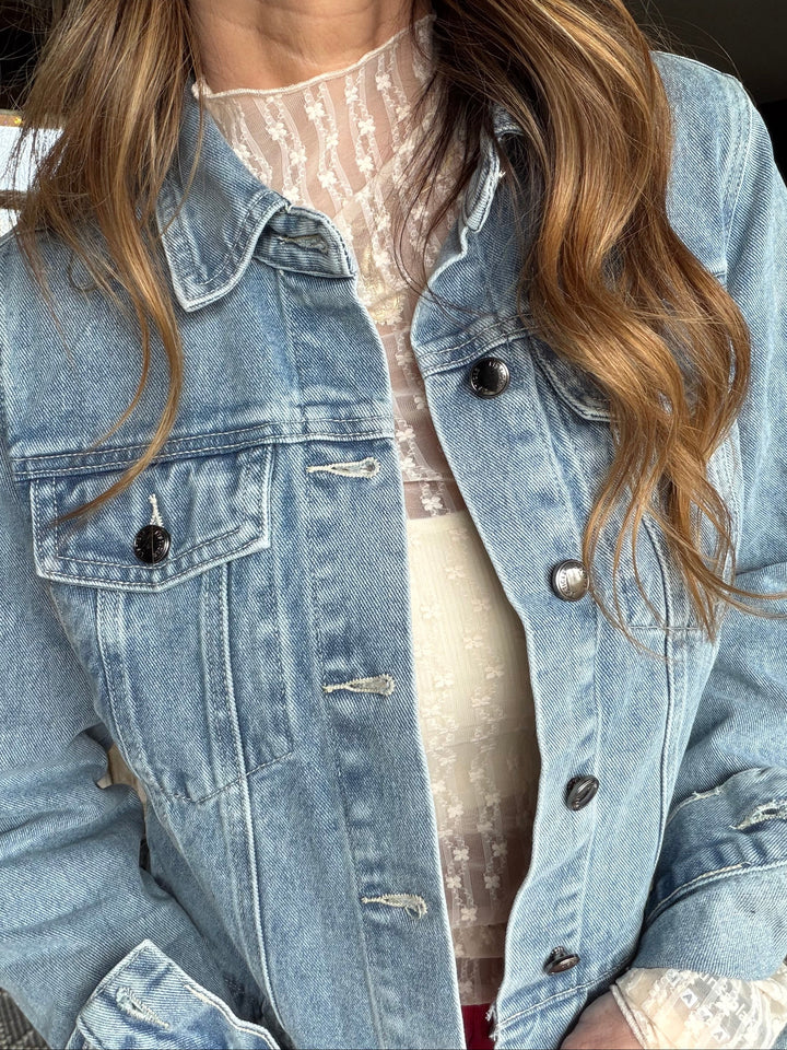 Light blue denim jacket cropped with a ruffle hem