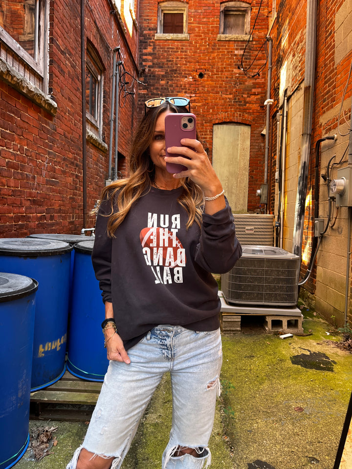 Black sweatshirt that says Run the Dang Ball for football season and game day