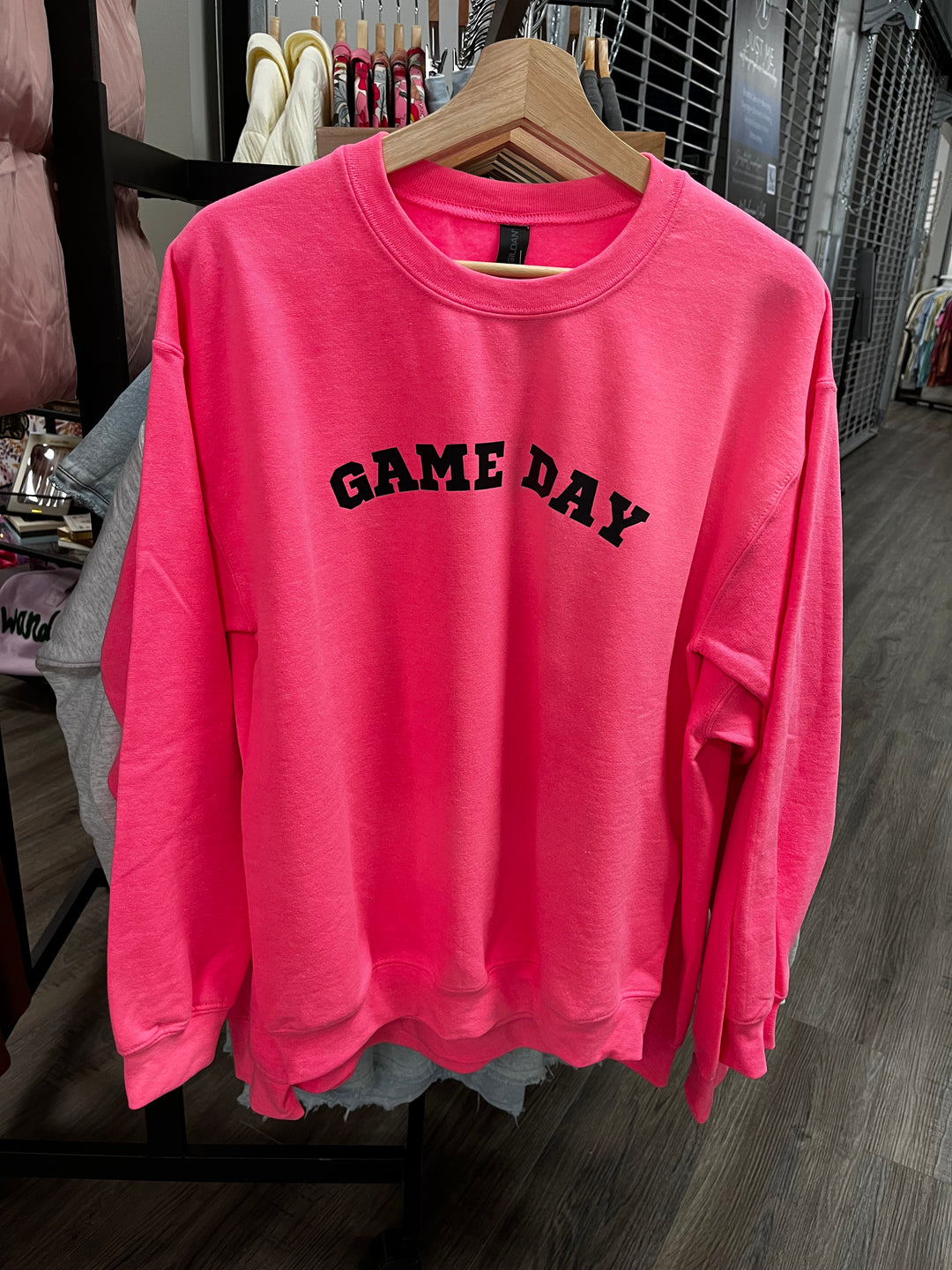 Hot pink unisex sweatshirt with black game day lettering